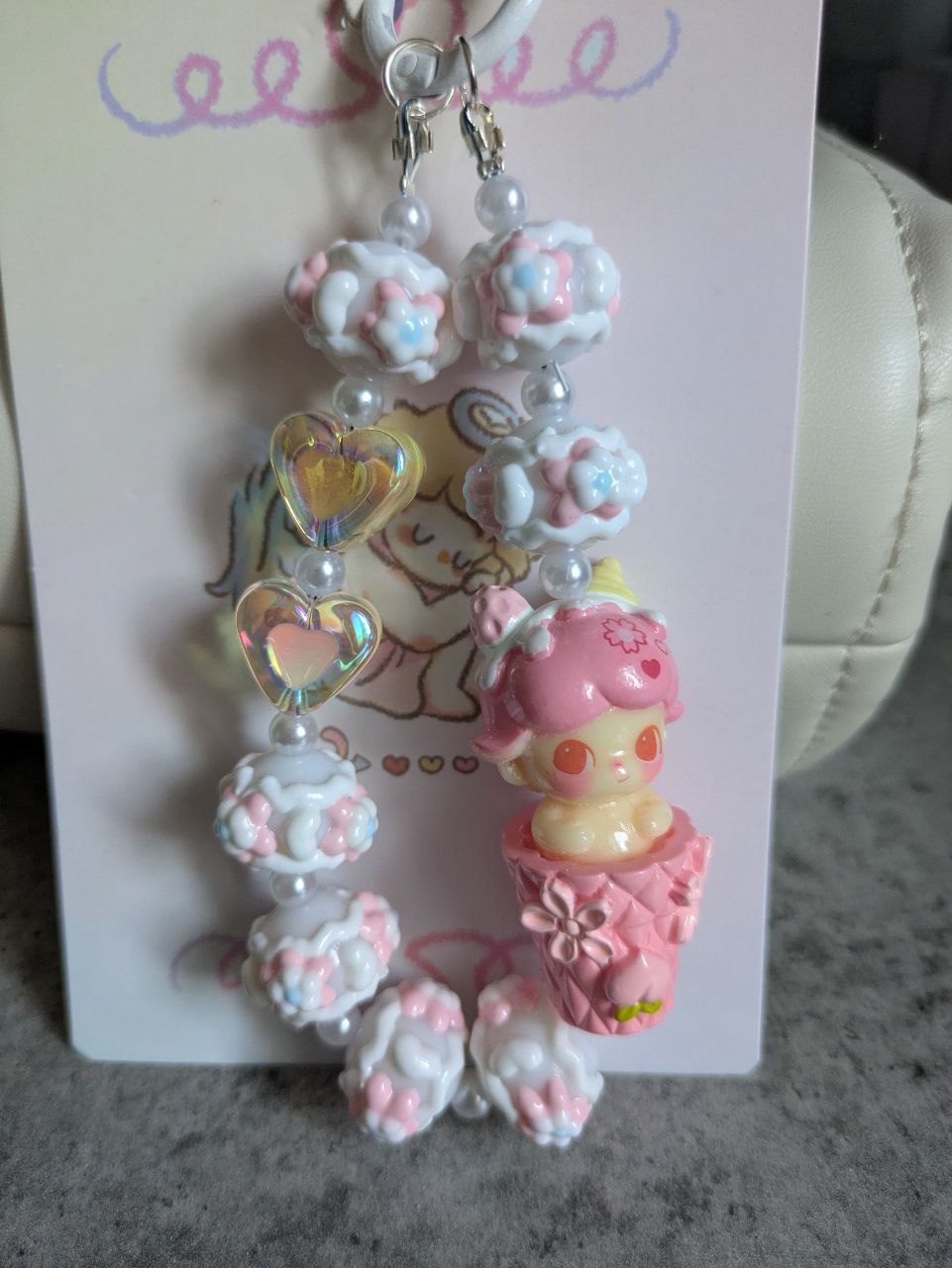 Rosa Dimoo Handykette & Taschenanhänger: Der süße kleine Anhänger